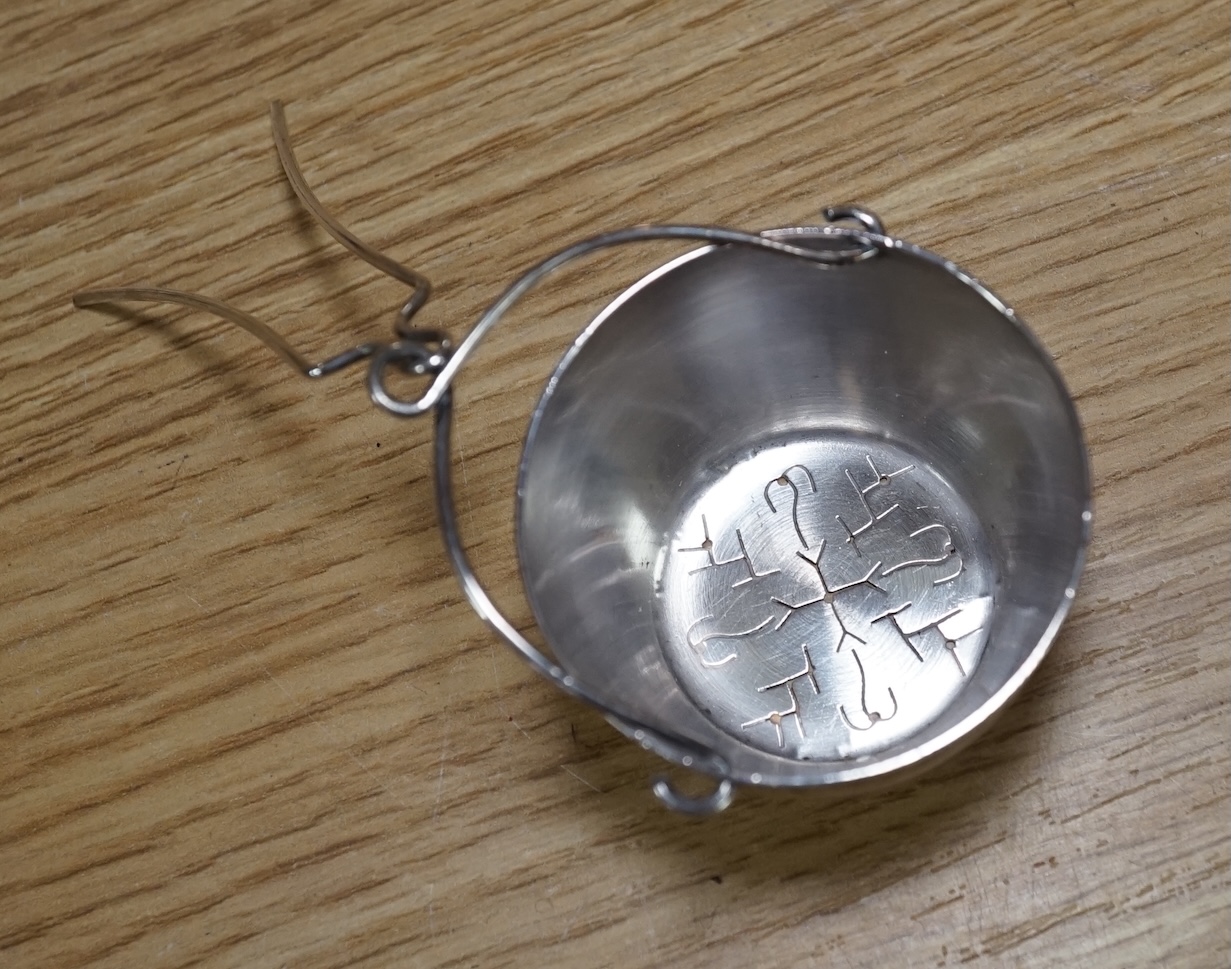 An Art Deco three piece silver brush set and a silver plated three piece tea set and miniature caldron, coffee pot 22cm high. Condition - fair